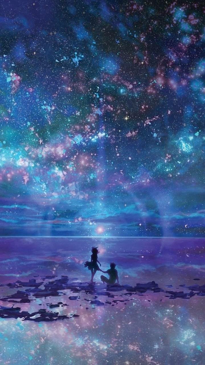 Anime-style wallpaper of a blue fantasy ocean and star-filled sky, featuring a couple standing together under a vast, glowing night sky.