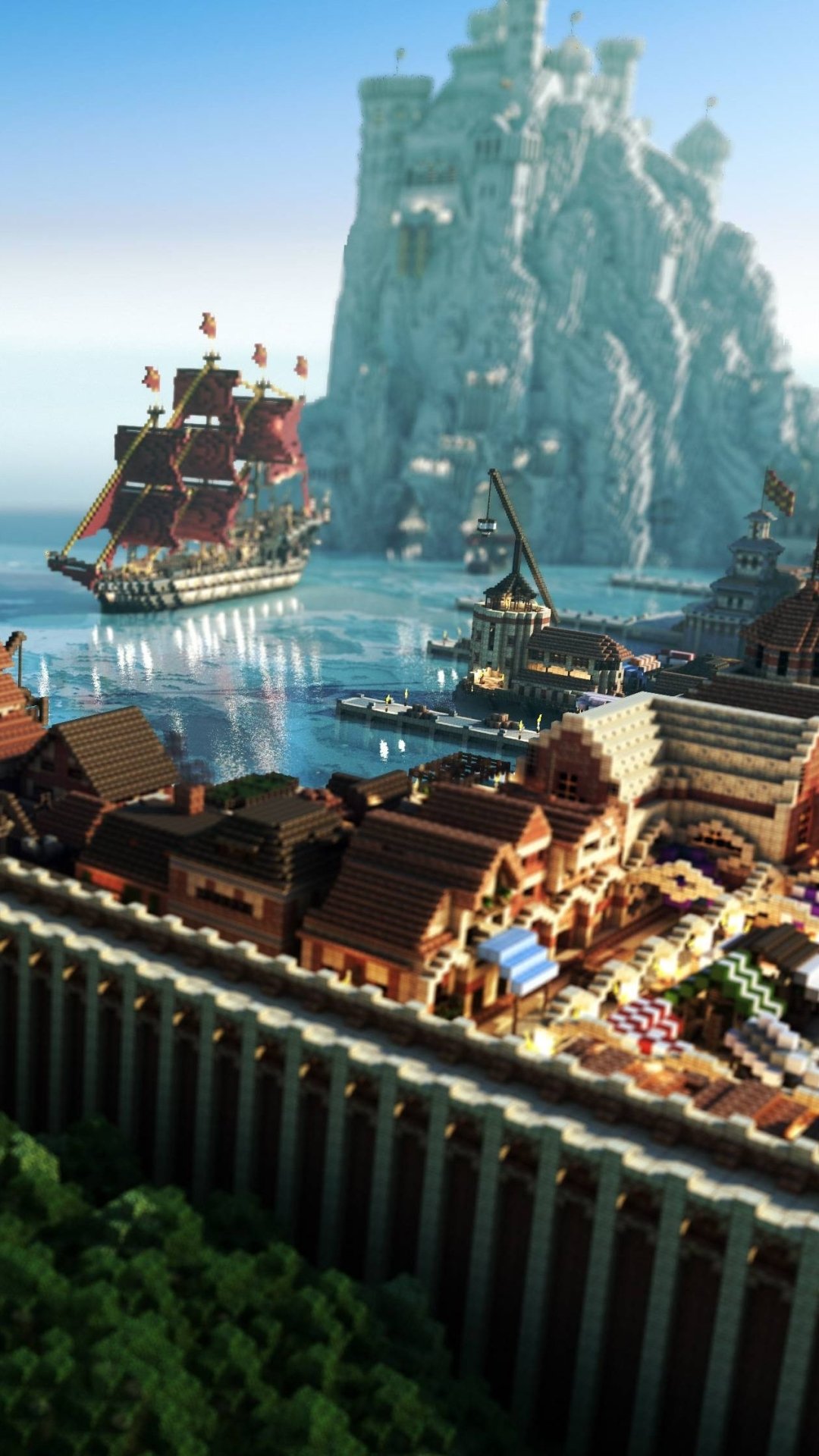 Minecraft-themed phone wallpaper showcasing a detailed coastal town with ships and a large castle on a rocky island, compatible with iPhone and Android screens.