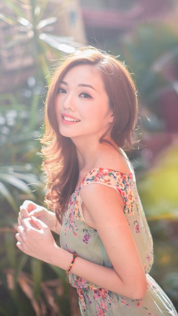sunny bokeh smile brown eyes brunette oriental model woman asian Phone Wallpaper