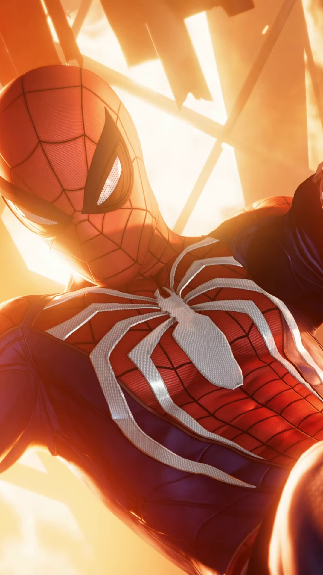 Video game Spider-Man (PS4) phone wallpaper: close-up of Spider-Man in red-and-blue suit with white spider emblem, backlit by warm orange city light.