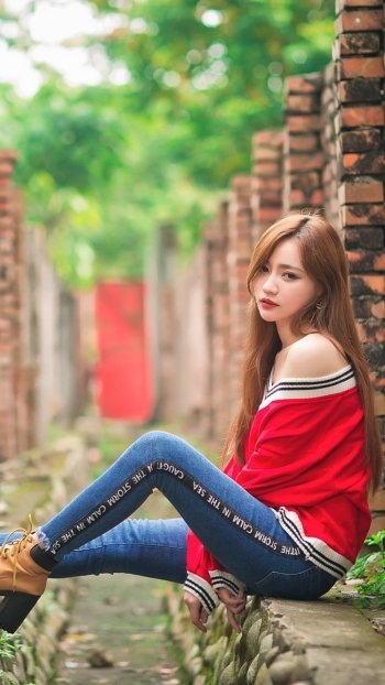 brick depth of field brunette long hair model woman asian Phone Wallpaper