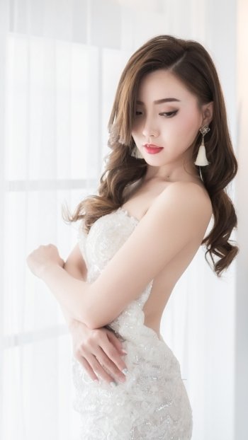 wedding dress white dress lipstick earrings brunette asian model woman bride Phone Wallpaper
