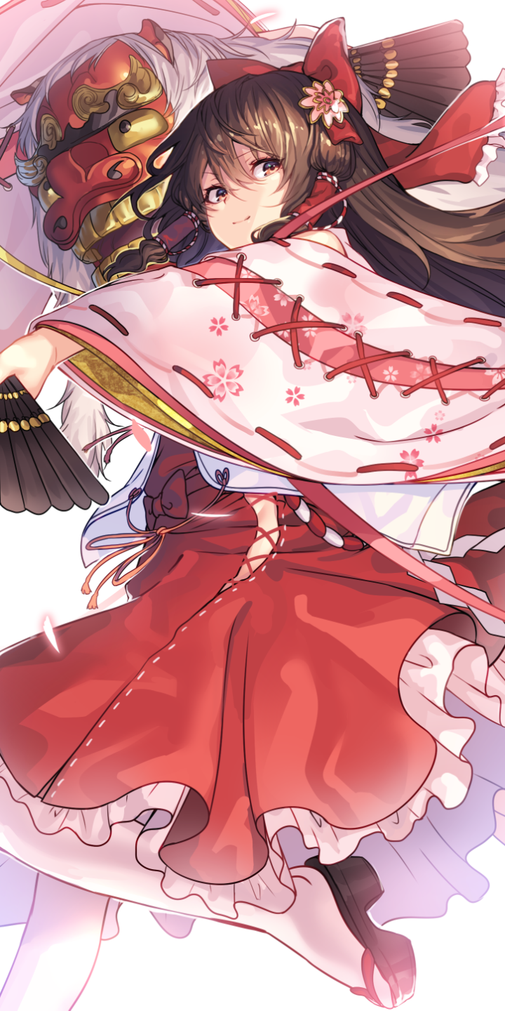 Phone wallpaper of Reimu Hakurei (Touhou): vibrant anime shrine maiden in red-and-white robes, flowing hair, ribboned bow, and a decorative mask behind her.