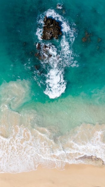 wave foam beach sand aerial nature ocean Ocean Waves Phone Wallpaper