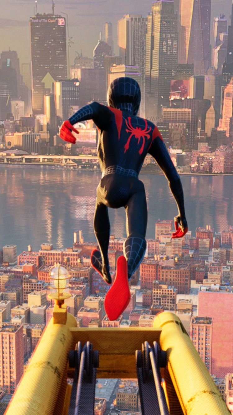 Phone wallpaper of Miles Morales as Spider-Man from the movie Spider-Man: Into the Spider-Verse, seen from behind as he leaps off a rooftop toward a sunlit city skyline.