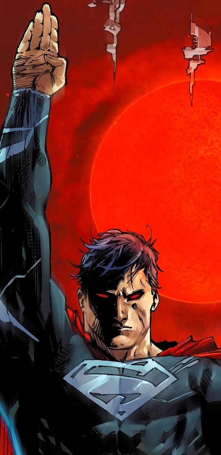 Comic Superman phone wallpaper: brooding hero in a black S-shield suit, raised arm before a blood-red sun and jagged, torn skyline.