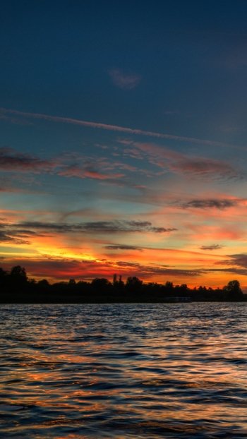  A Boat In The Setting Sun
