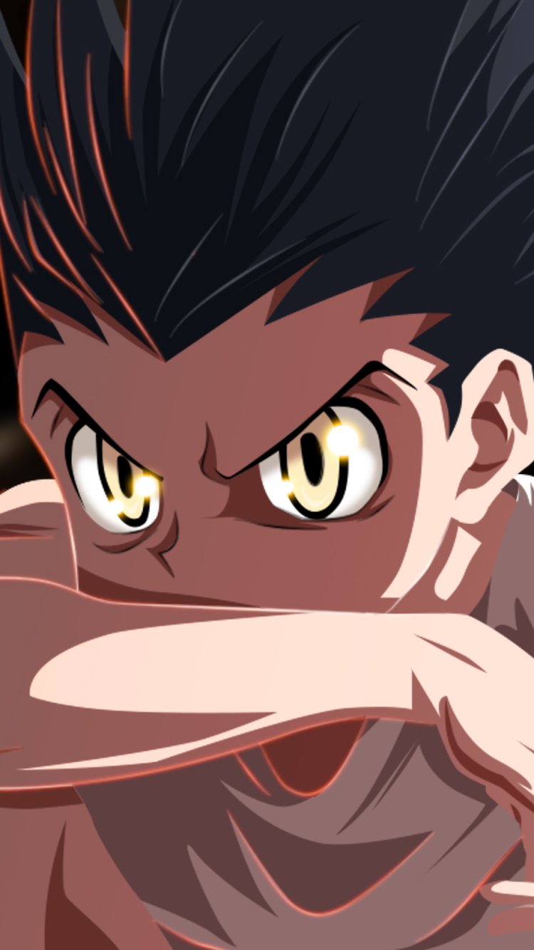Hunter x Hunter anime phone wallpaper — close-up of Gon with dark spiky hair, fierce golden eyes and his arm raised across his face, intense determined expression.