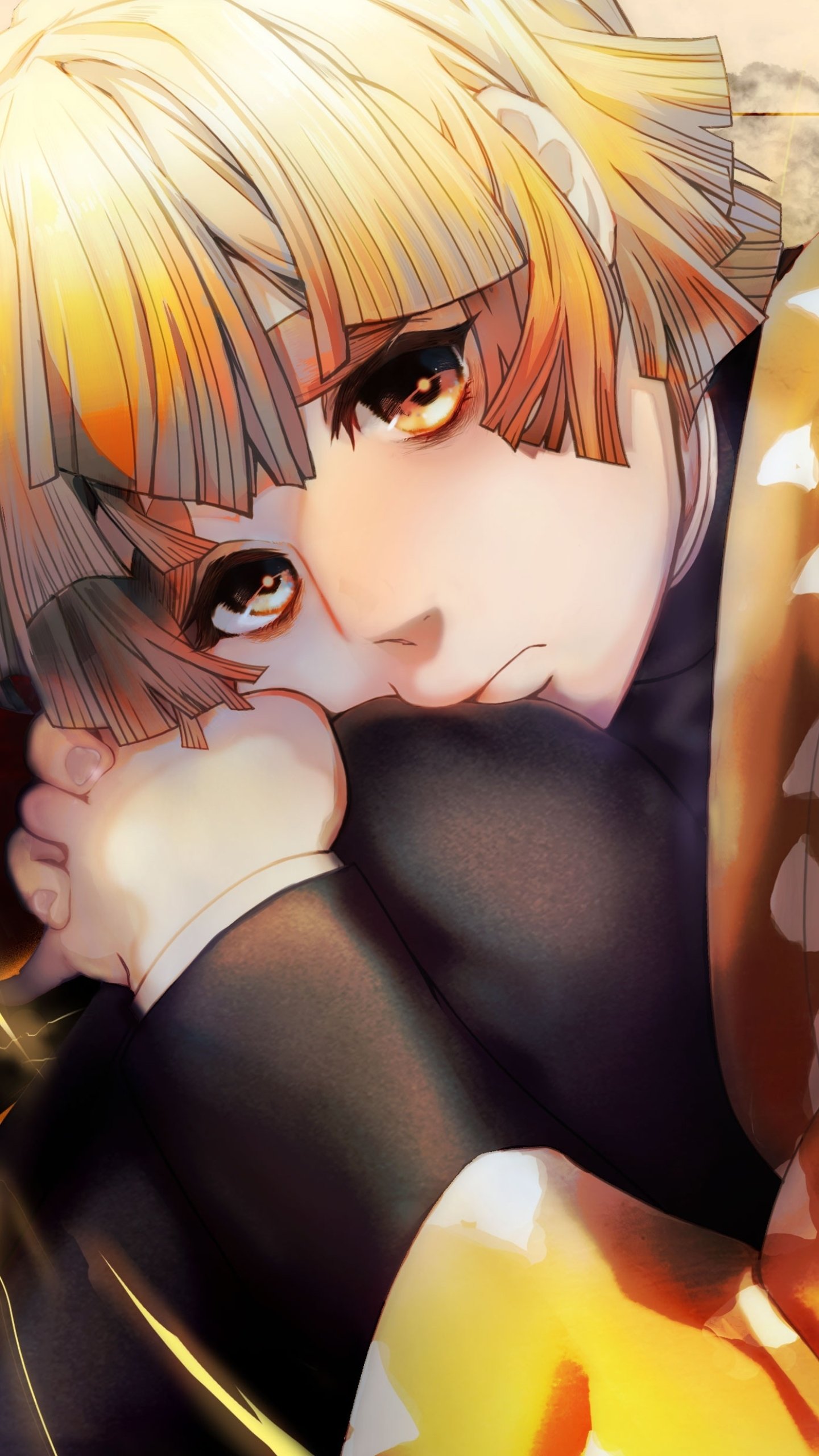 Phone wallpaper portrait of Zenitsu Agatsuma from Demon Slayer: Kimetsu no Yaiba — anime close-up of him curled against his knees, pensive gaze and warm golden lighting.