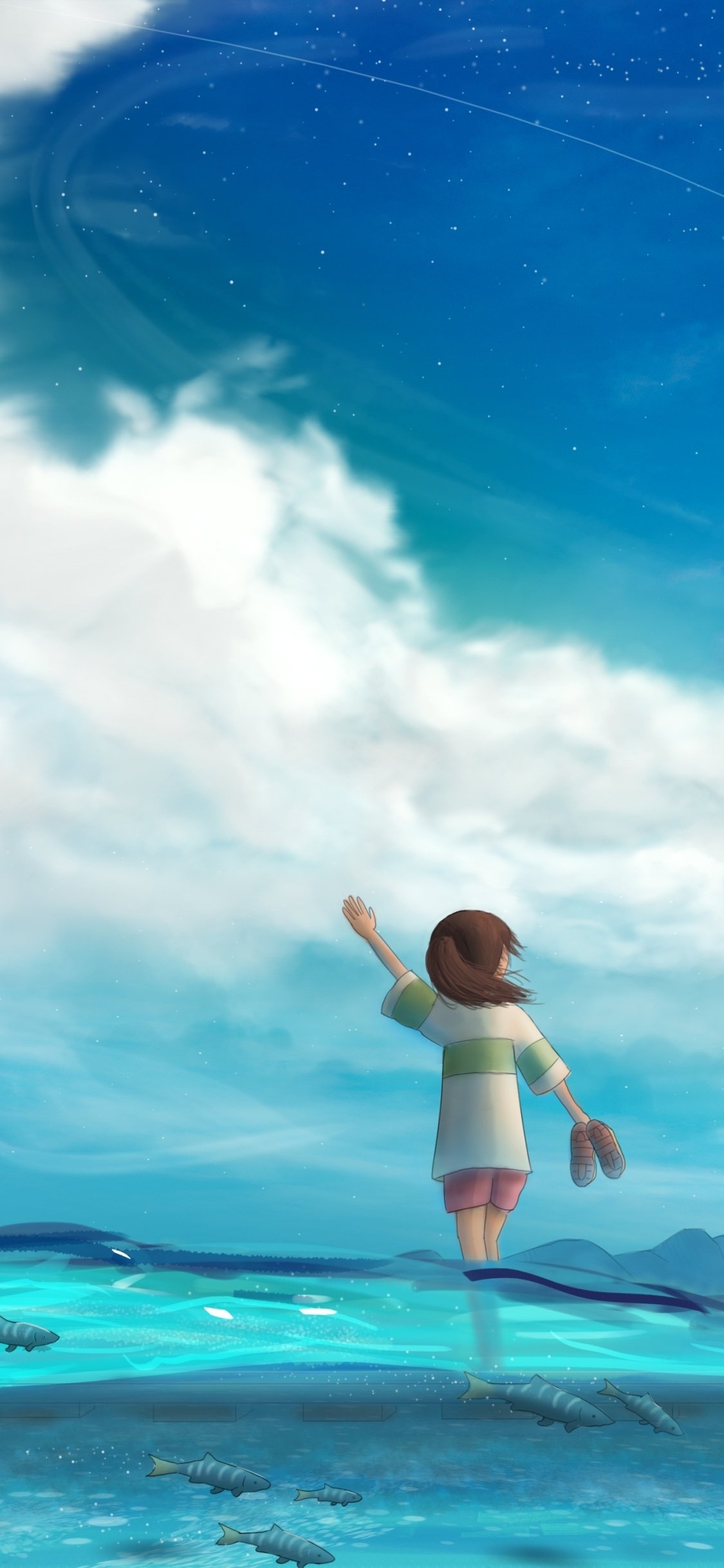 Anime Spirited Away phone wallpaper: girl wades barefoot in shallow turquoise sea, holding her shoes and reaching toward a vast, star-streaked sky above luminous clouds.