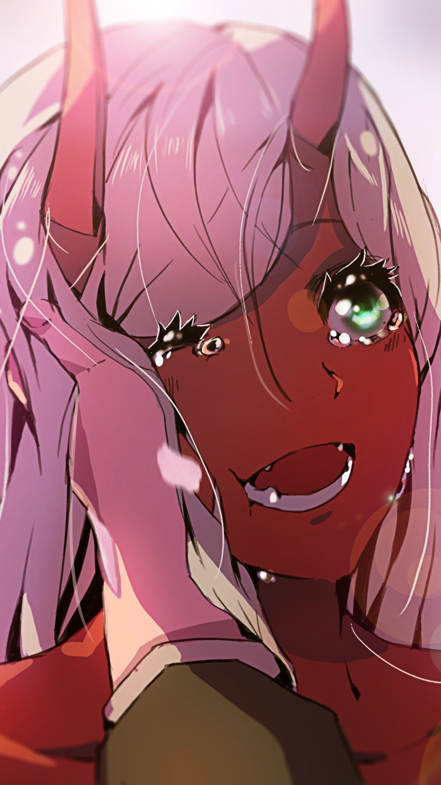 Close-up phone wallpaper of Zero Two (Darling in the FranXX): pink hair and red horns, teary and smiling with sparkling green eyes, hand to her face, warm glowing light.