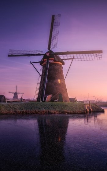 sunrise sky building man made windmill Phone Wallpaper