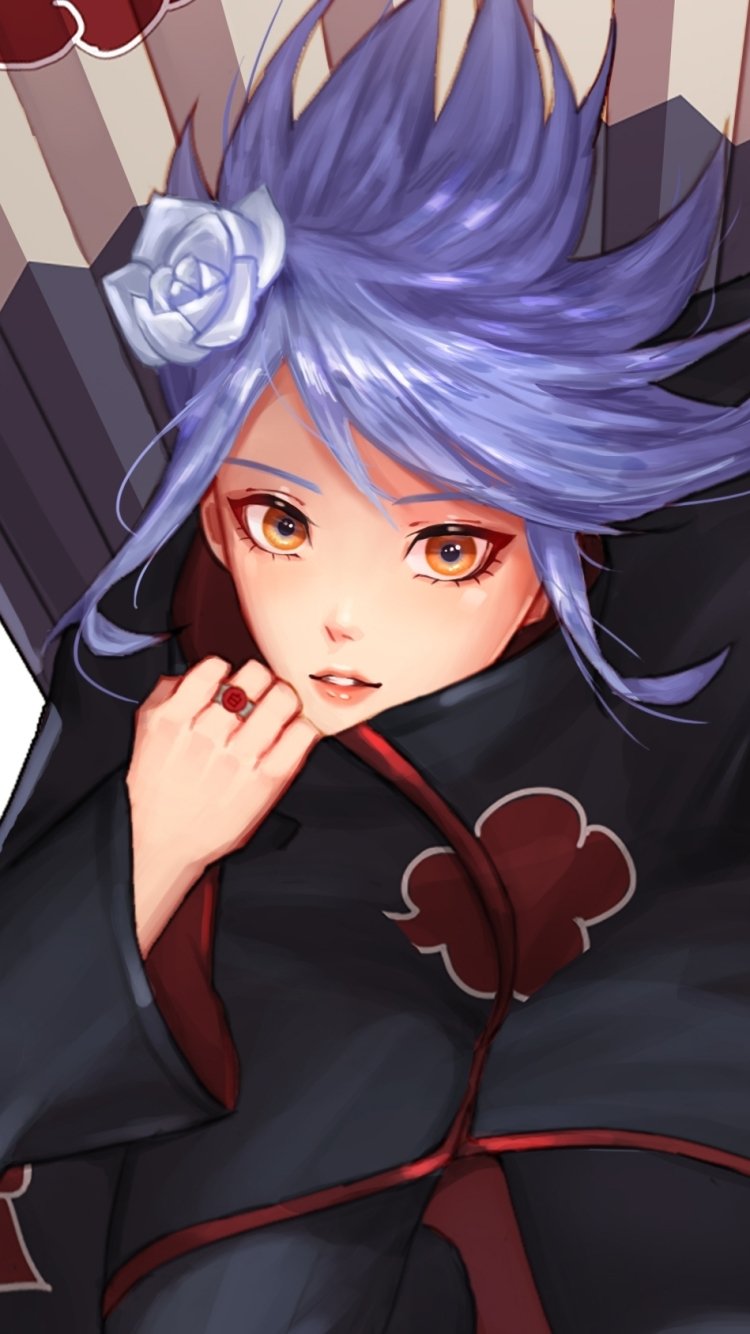 Phone wallpaper: Konan (Naruto), anime close-up — purple hair with paper flower, Akatsuki cloak, amber eyes and a hand near her face.
