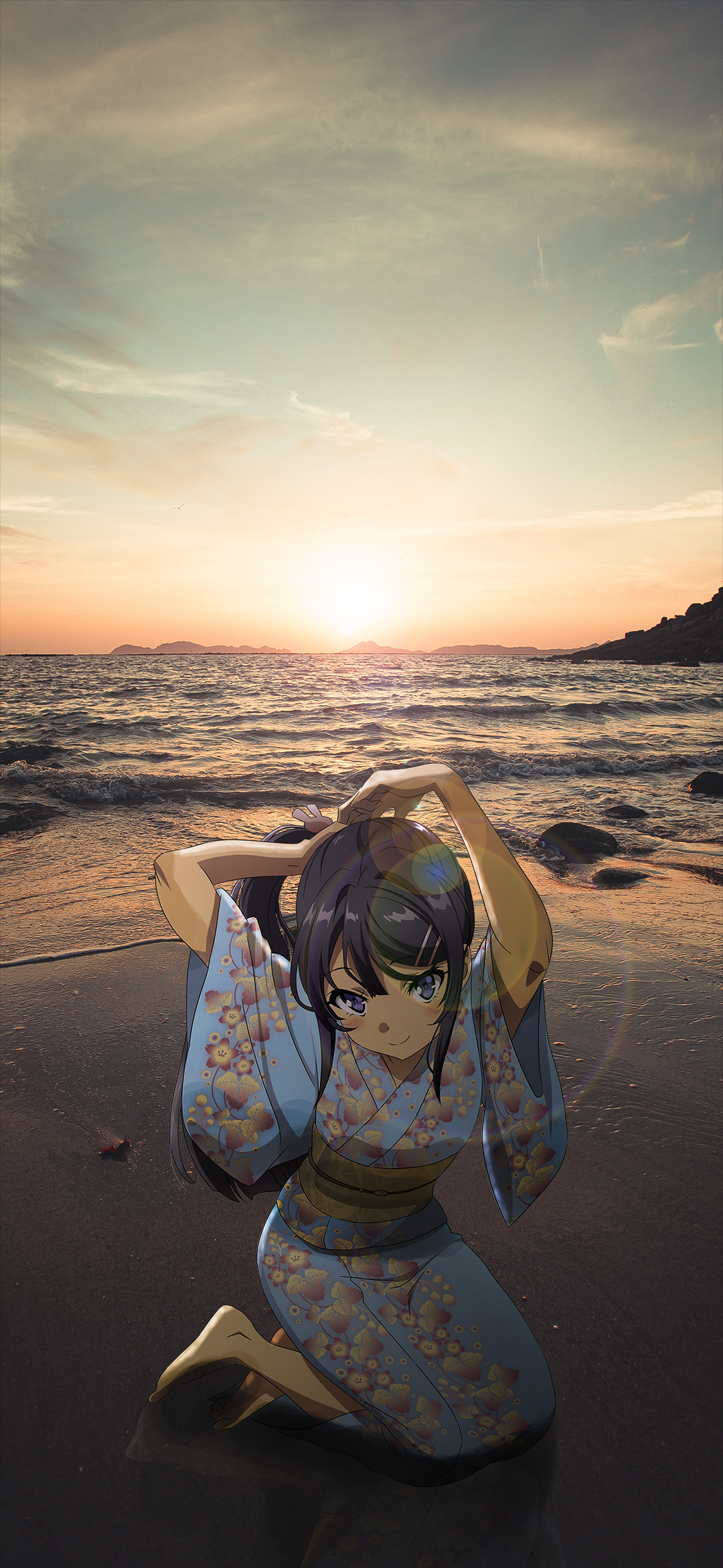 Phone wallpaper featuring Mai Sakurajima from Rascal Does Not Dream of Bunny Girl Senpai kneeling on a beach at sunset, blending anime character with a serene natural background.