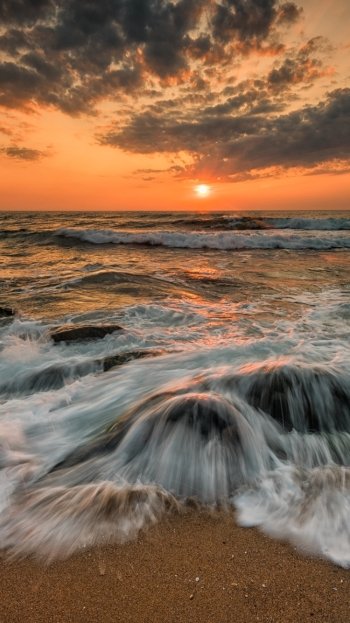  Waves over Ocean Rocks at Sunset