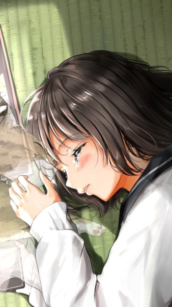 Phone wallpaper of an anime girl with short black hair lying on a green mat, cradling a steaming cup, bathed in soft light with a gentle, contemplative expression.