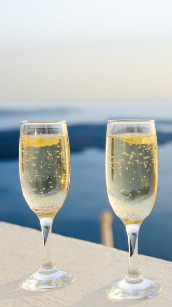  Glasses of sparkling champagne with an ocean view