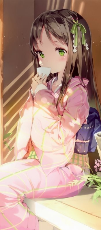 Phone wallpaper featuring an anime girl: long-haired anime girl with green eyes and a hair ribbon, in pink loungewear sipping tea by a sunlit window.