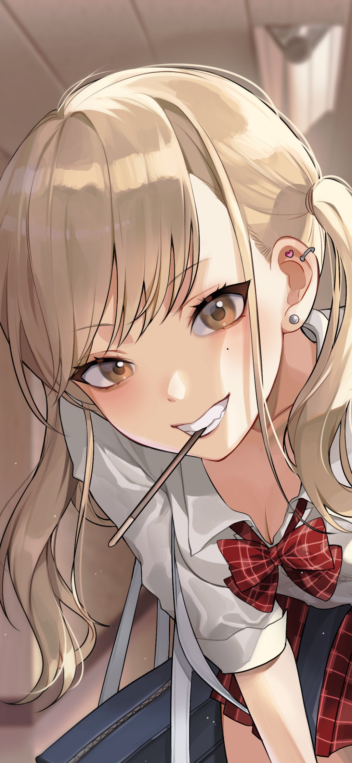 Vertical phone wallpaper for iPhone and Android: blonde anime schoolgirl in a plaid uniform, leaning forward with a lollipop stick and warm lighting.