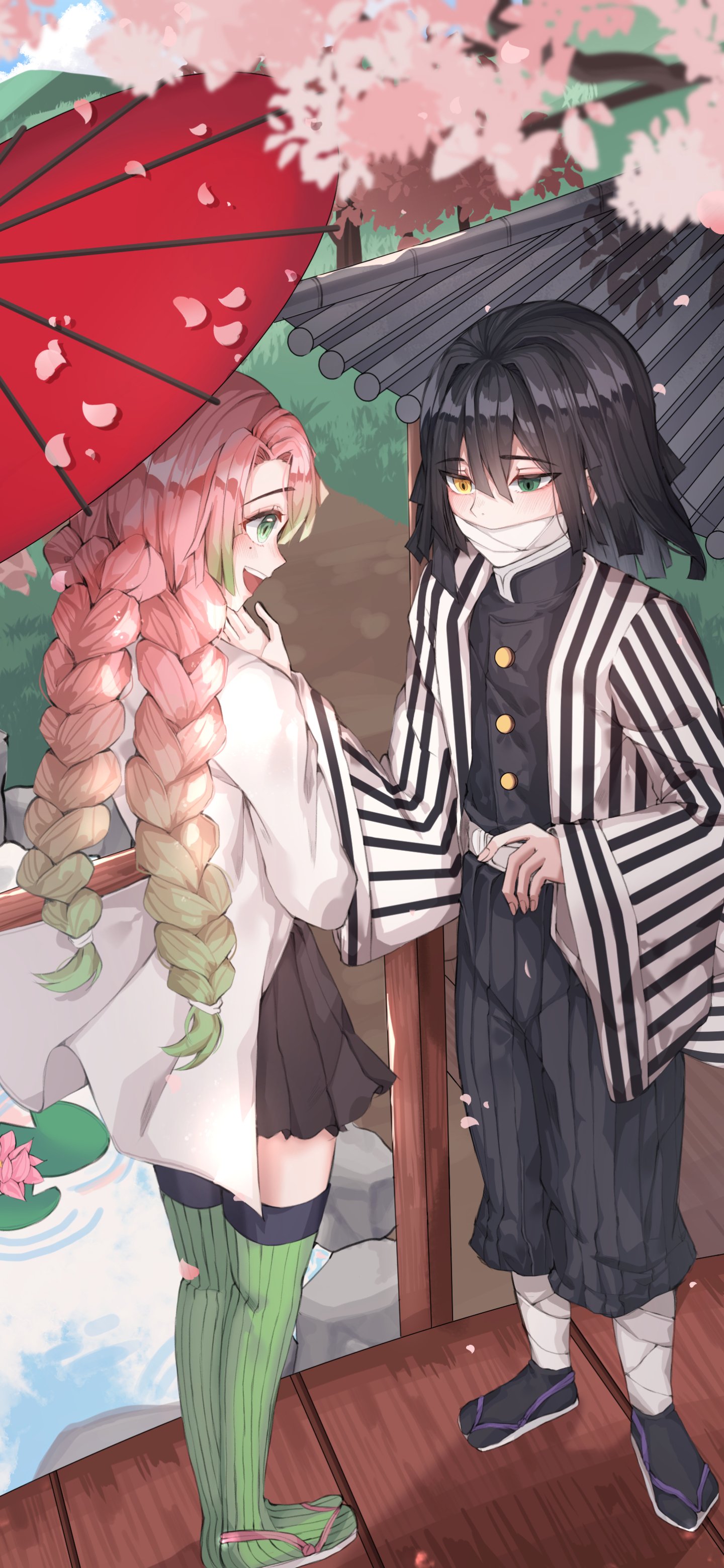 Phone wallpaper of Mitsuri Kanroji and Obanai Iguro from Demon Slayer standing on a wooden porch under umbrellas and falling cherry blossoms, their hands gently touching.