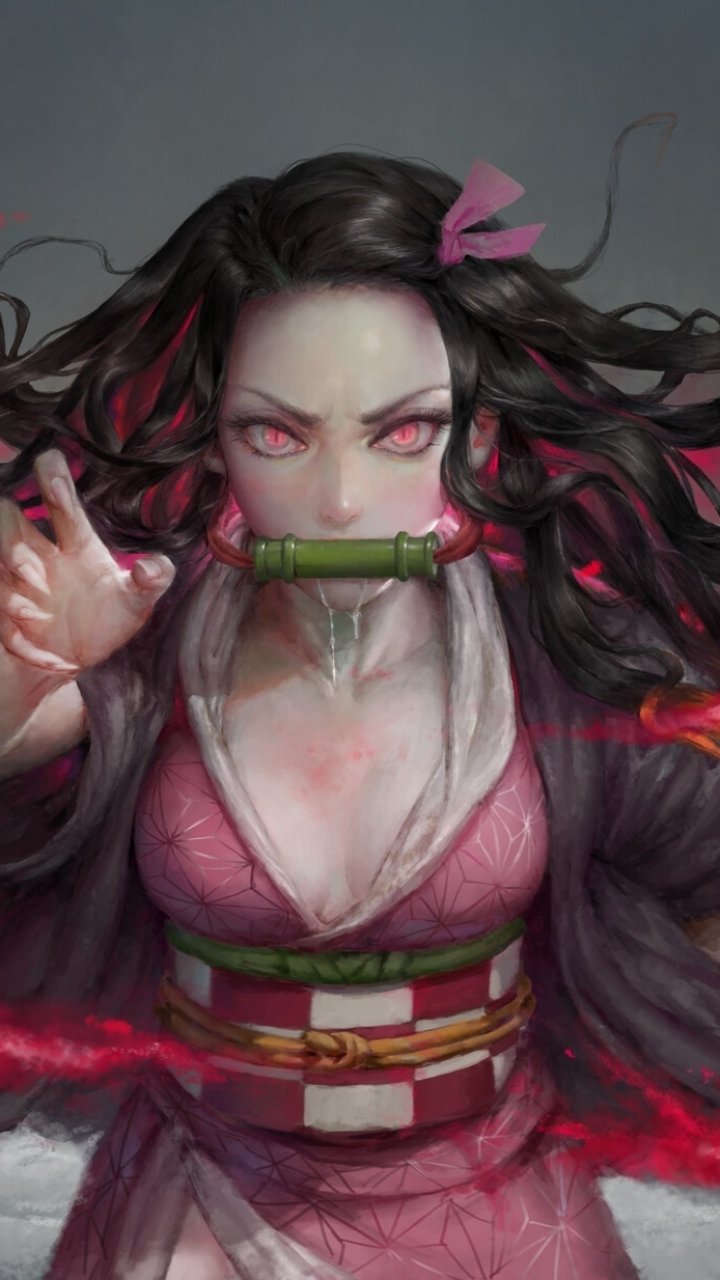 Nezuko Kamado anime phone wallpaper from Demon Slayer: Kimetsu no Yaiba — fierce portrait with glowing pink eyes, bamboo muzzle, flowing dark hair and streaks of crimson energy.