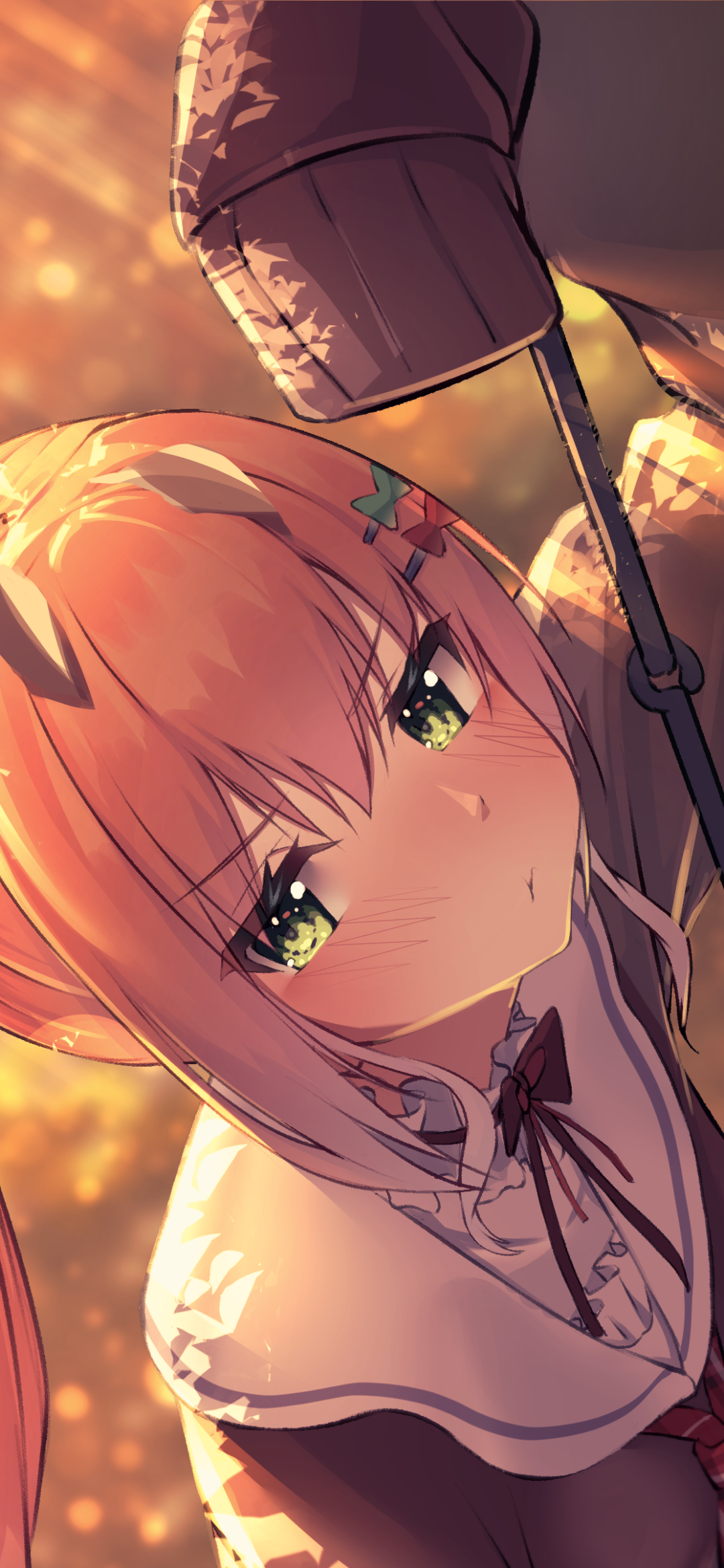 Anime-style phone wallpaper featuring Momosuzu Nene, a Virtual YouTuber from hololive, with warm lighting and a close-up of her expressive green eyes.