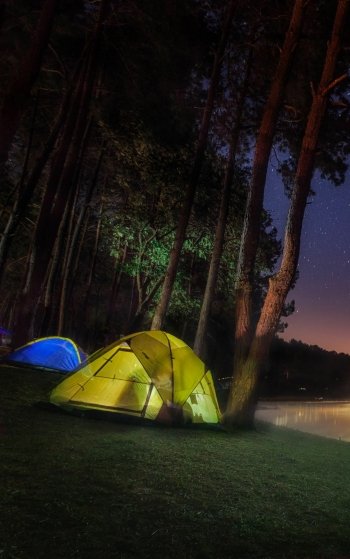  Camping in tents by a starlit mountain lake