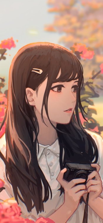 Phone wallpaper featuring an anime girl in profile holding a camera among pink blossoms, long dark hair, soft pastel colors and warm evening light.