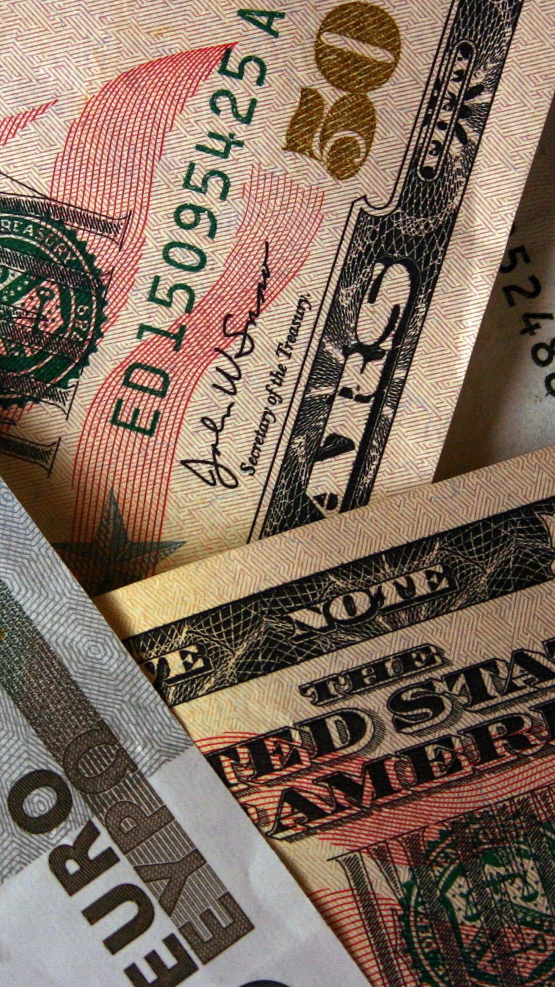 Close-up phone wallpaper of man-made money: overlapping U.S. dollar and euro banknotes with visible textures, serial numbers, and printed details.