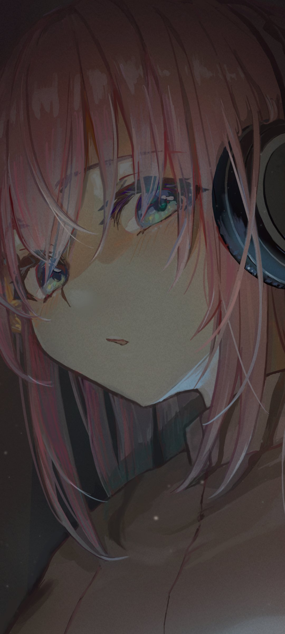 Vertical phone wallpaper of Hitori Gotou from Bocchi the Rock!: close-up anime portrait with pink hair, glasses, green eyes and headphones in moody soft lighting.