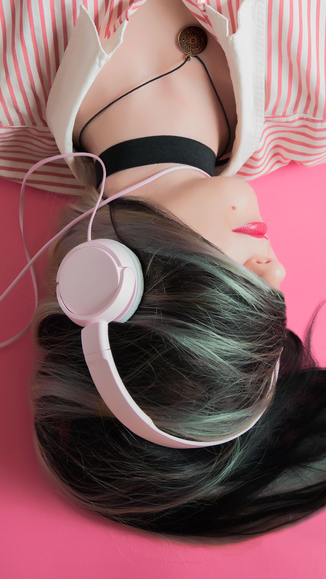 Woman in pink with headphones