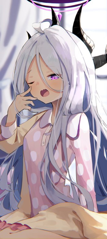 Phone wallpaper of Sorasaki Hina from the video game Blue Archive: sleepy, long silver hair with horns, wearing pink polka-dot pajamas, lounging on a bed.