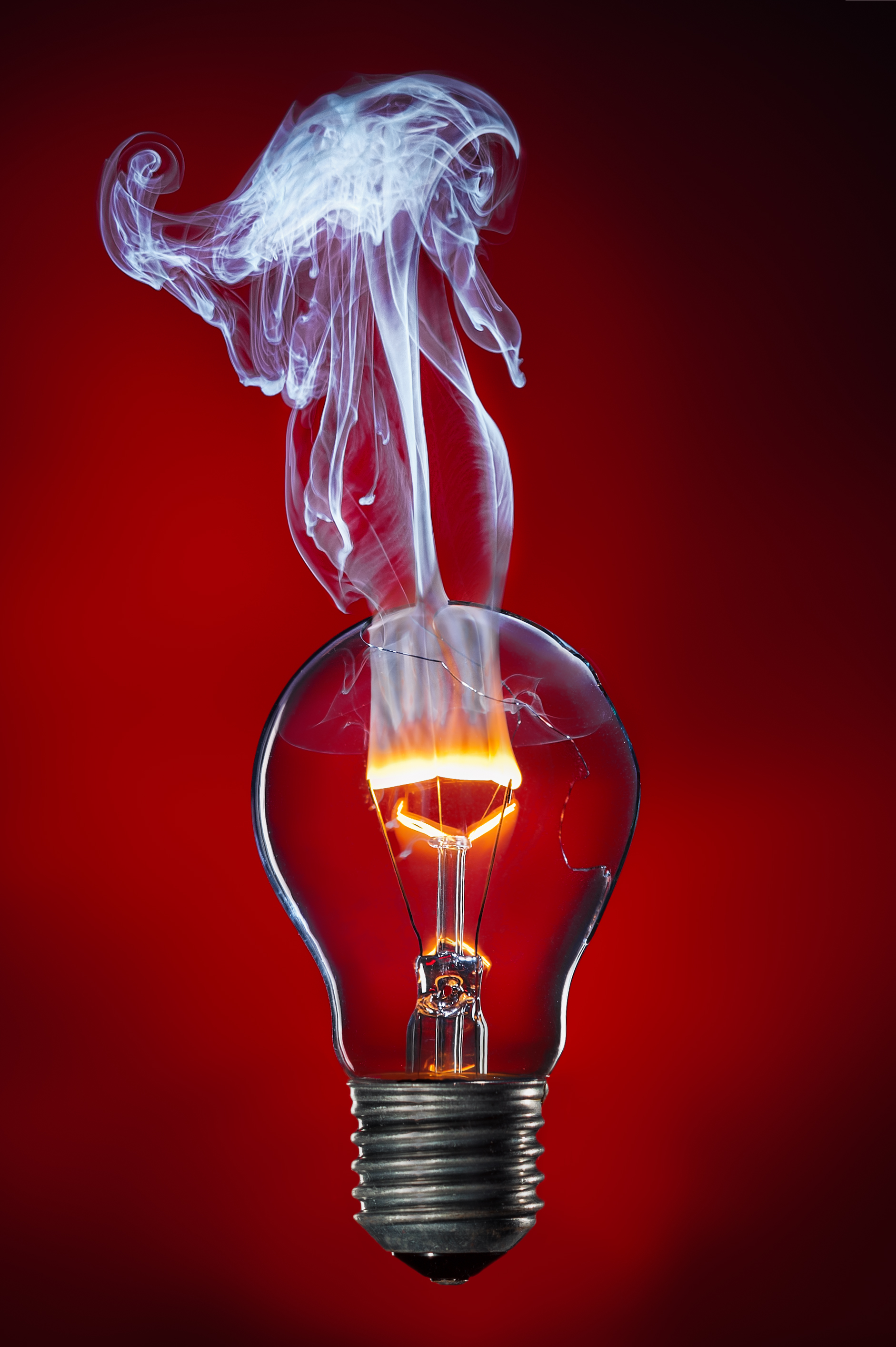 Burning filament of a light bulb with damaged glass bulb by Stefan Krause