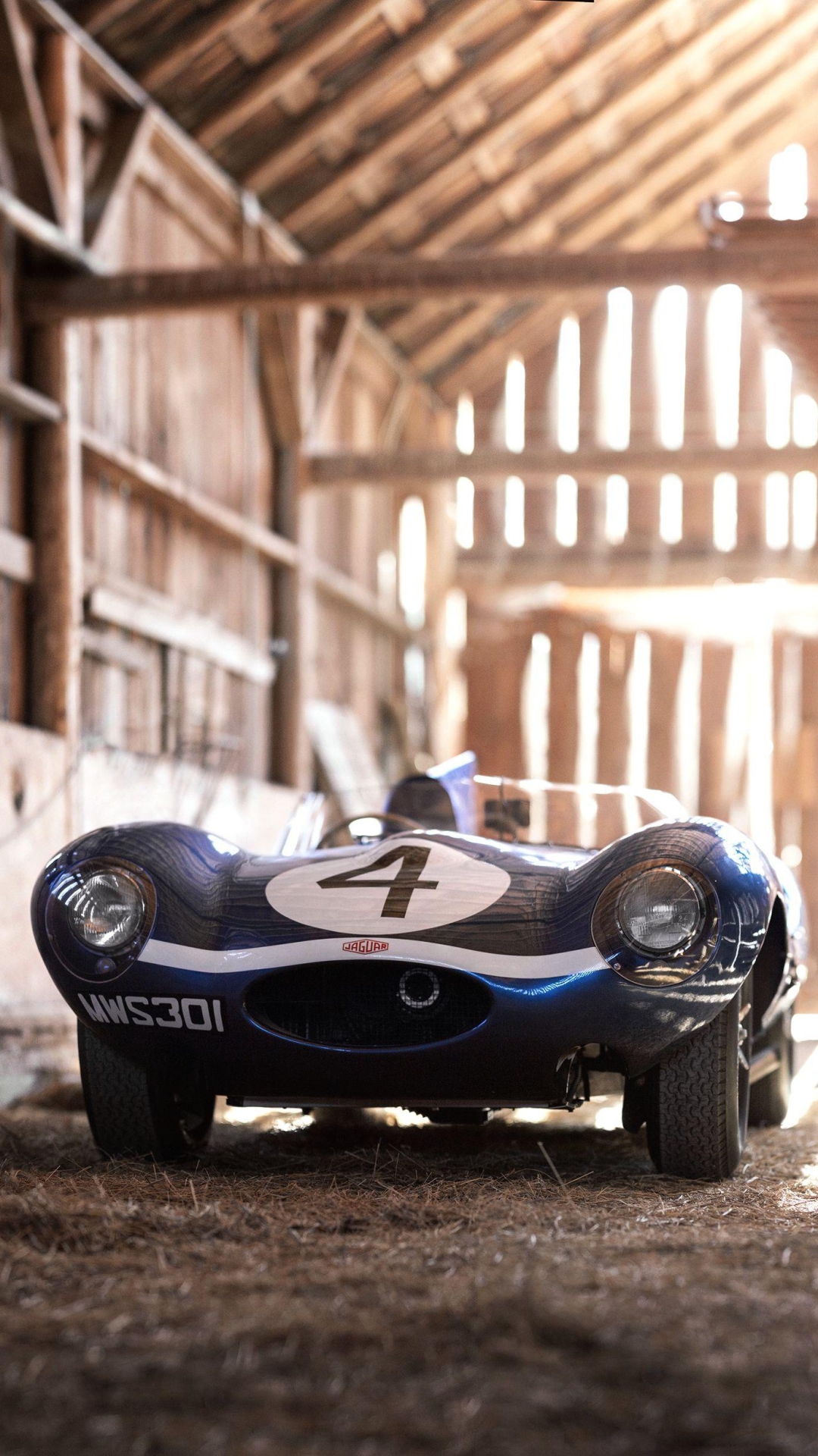 Blue Jaguar D-Type in a barn