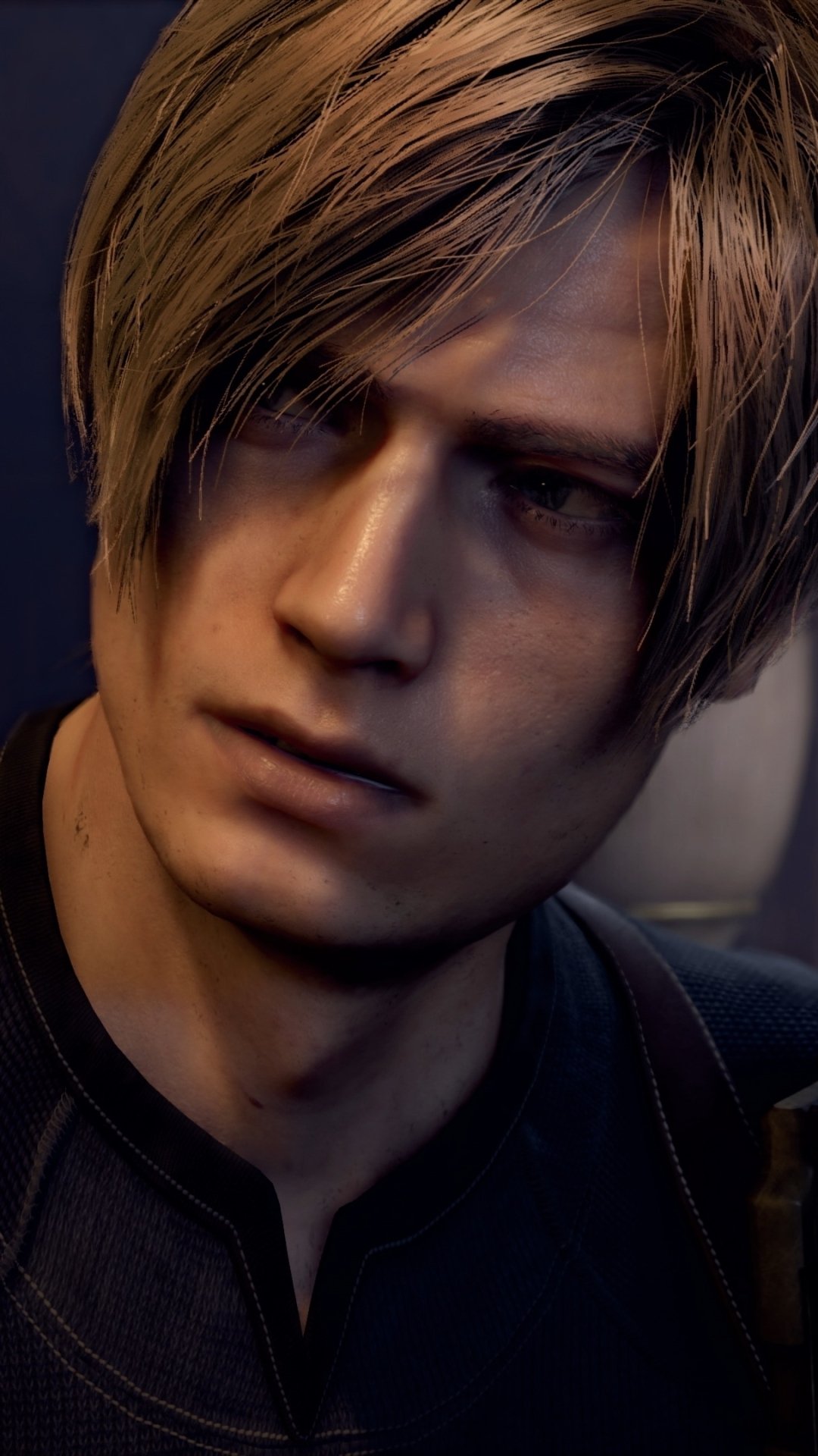 Phone wallpaper close-up of Leon S. Kennedy from the video game Resident Evil 4 (2023): serious expression, blond hair partially over his eye, dim cinematic lighting and tight framing.